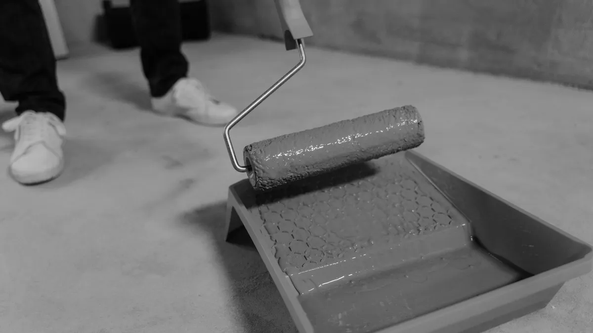 How to Protect a Stamped Concrete Patio from UV Fading Paint roller in tray for coating application