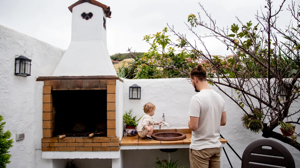 Outdoor pizza oven and prep counter in patio